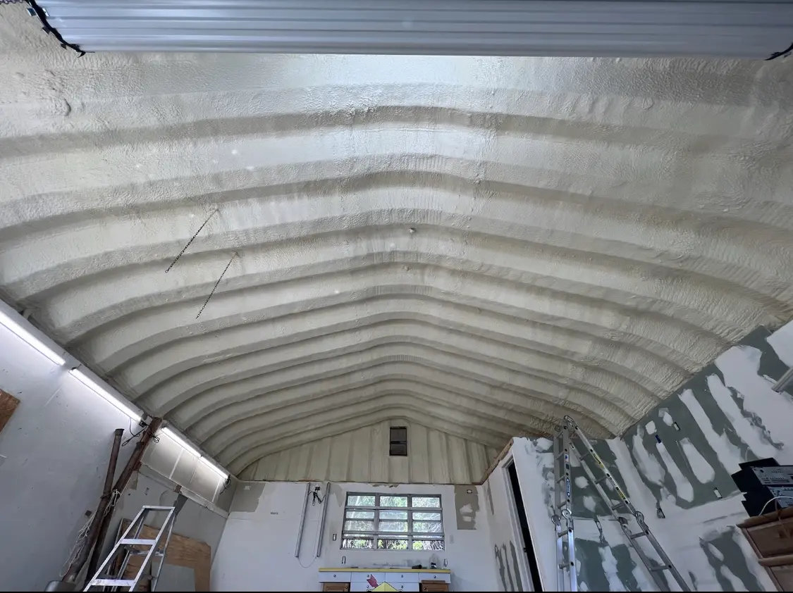 Spray polyurethane foam applied to the underside of a metal roof deck in Claremont